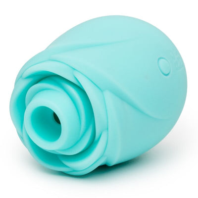 Rose ROMP Rose Glow turquoise couchée sur le côté, avec pétales sculptés et embout circulaire au premier plan