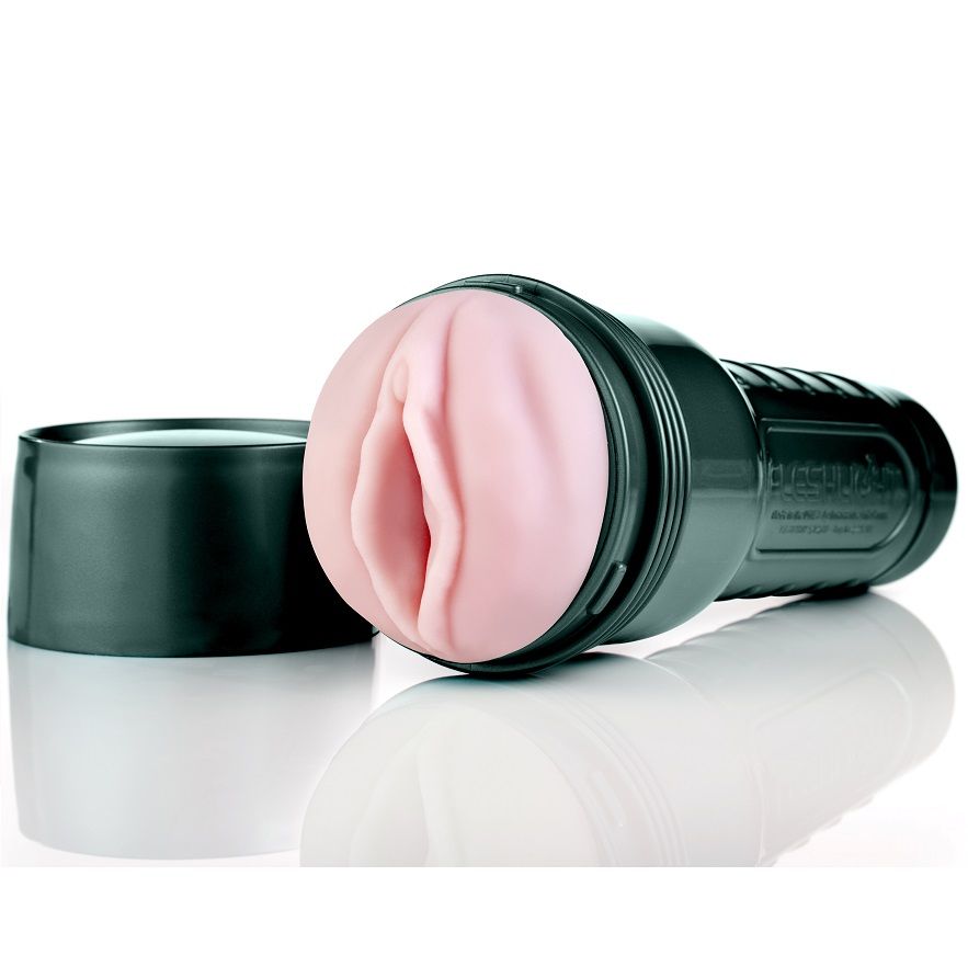 Étui vert sombre Fleshlight GO Surge avec insert rose et capuchon détaché à côté