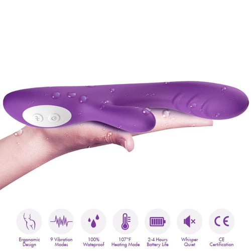 Vibromasseur violet posé sur une main avec gouttes d’eau, pictogrammes de 9 modes et chauffage à 107 °F