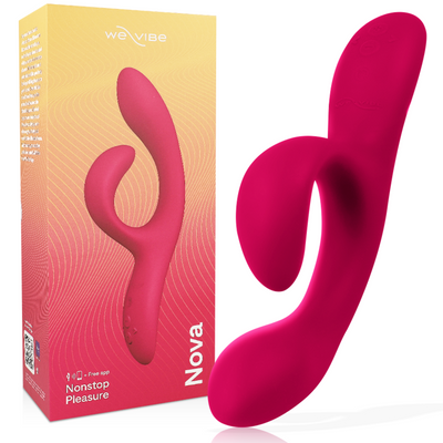 We-Vibe Nova rose fuchsia à deux branches courbes devant sa boîte dégradée jaune et rose