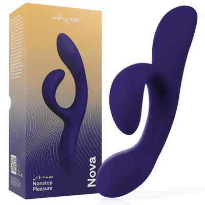 We-Vibe Nova 2 violet foncé à deux branches courbes devant sa boîte dégradée jaune et violet
