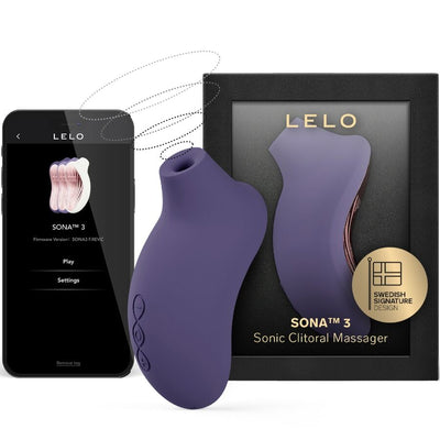 Stimulateur violet foncé LELO Sona 3 devant sa boîte noire, avec application montrée sur un téléphone