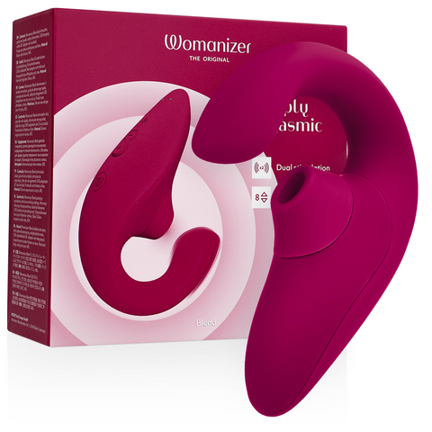 Womanizer Blend framboise à double branche courbe devant sa boîte rose foncé, embout circulaire visible