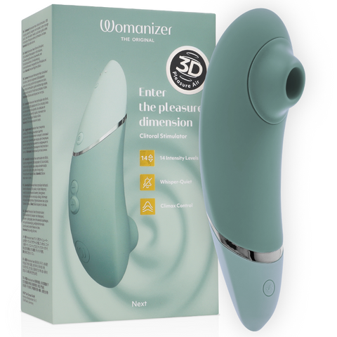 Womanizer Next vert sauge devant sa boîte, embout rond dirigé vers la droite et base bleu clair