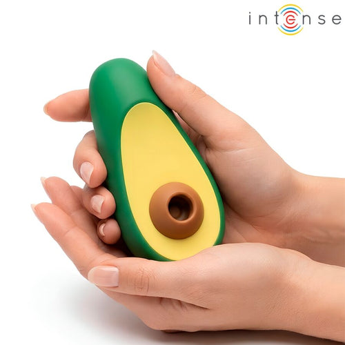 Petit appareil vert et jaune tenu entre deux mains, avec embout brun circulaire