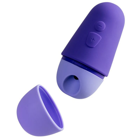 Stimulateur ROMP Free X violet à deux boutons, embout rond et capuchon amovible posé à côté