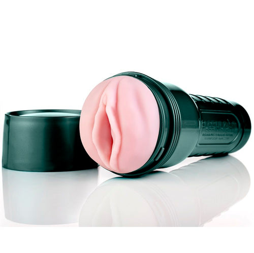 Étui vert sombre Fleshlight GO Surge avec insert rose et capuchon détaché à côté