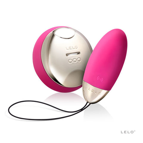 Œuf rose LELO Lyla 2 avec cordon noir et télécommande ronde rose, aux faces métallisées visibles